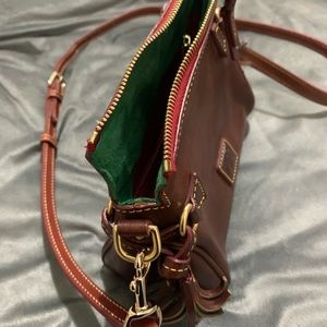 Beautiful Dooney Bourke brown crossbody bag. Demissions 8 x 7 inches